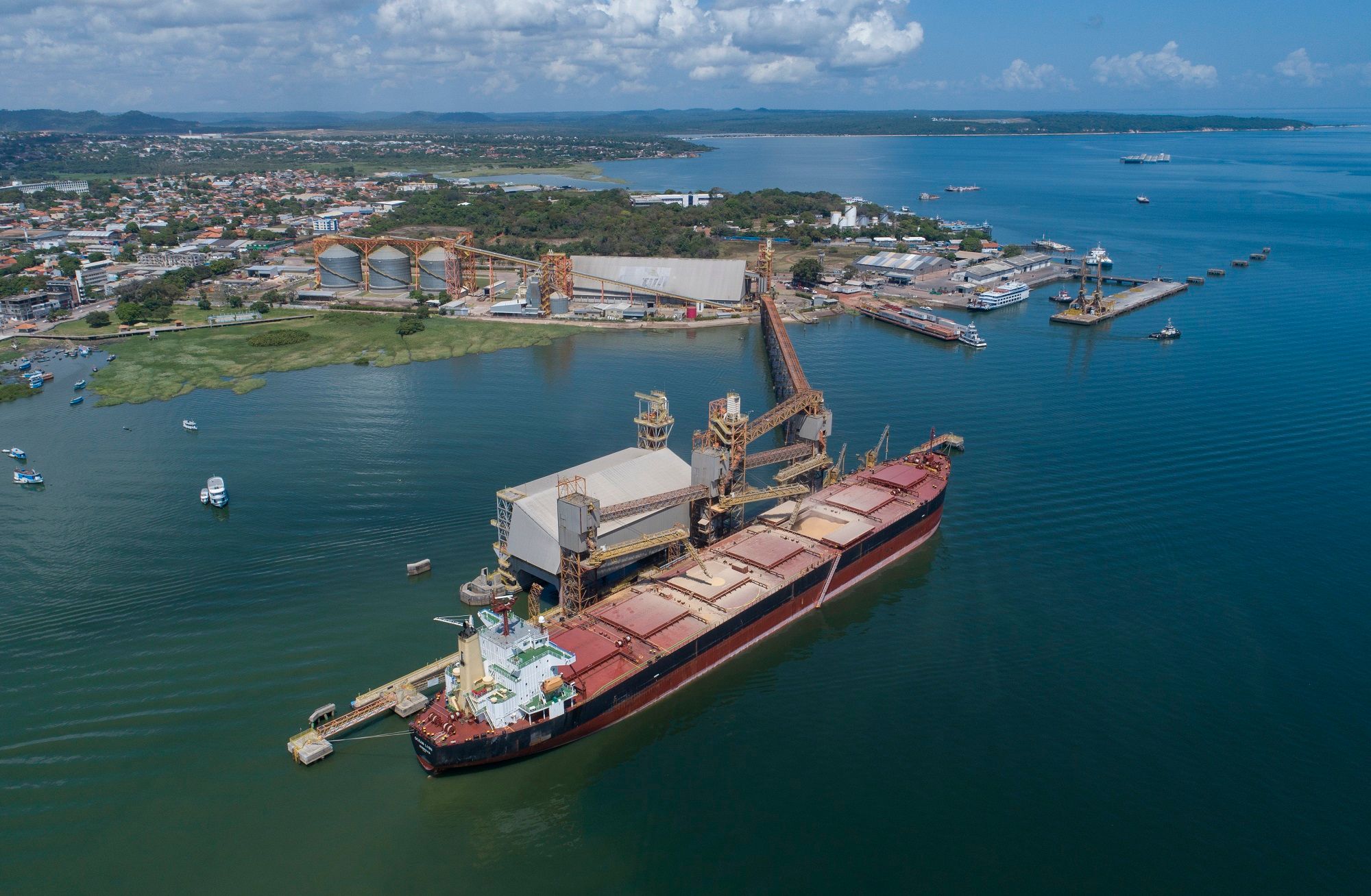 A bulk carrier is loaded with corn at the Cargill port in Santarem, Para state, Brazil, Wednesday, Aug. 26, 2020. Fishermen in the area blame cargo ships and ferries routed to the Santarém port which takes Brazil's soybeans, beef and corn abroad, of muddying the waters. 